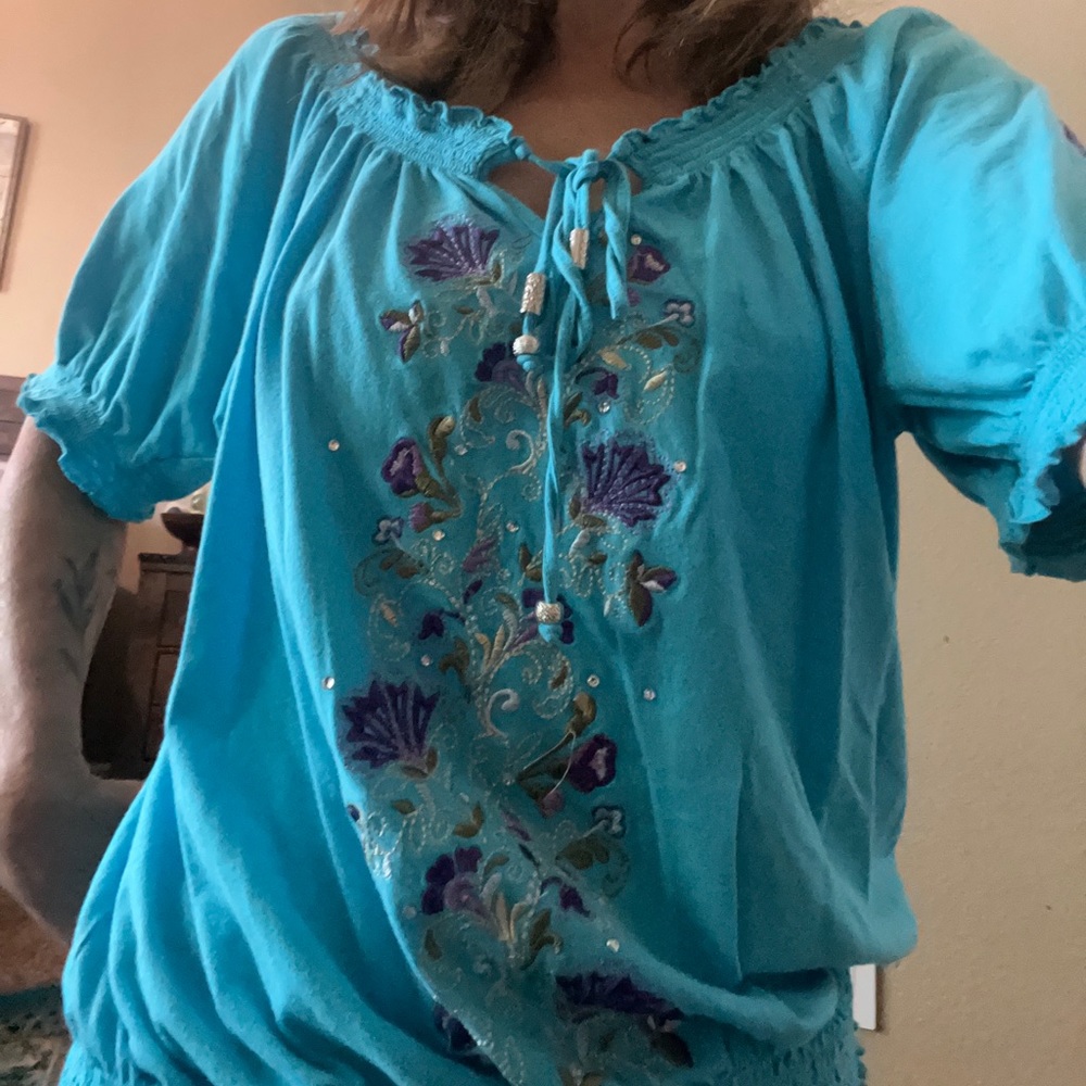 Embroidered turquoise blouse by anthropology